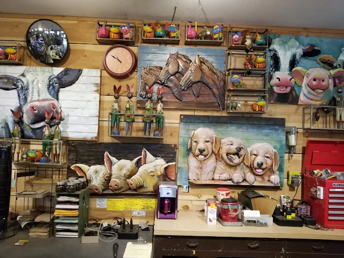 Wall of metal garden art and hand-painted animal signs in the gift shop